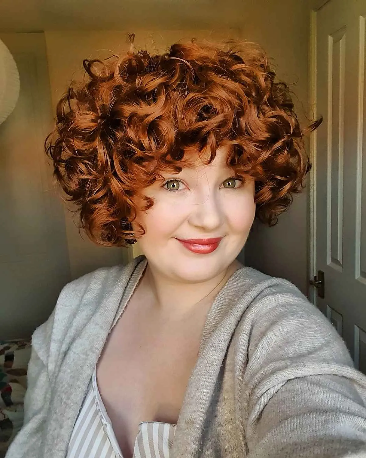 charming ginger short hairstyle for curly locks