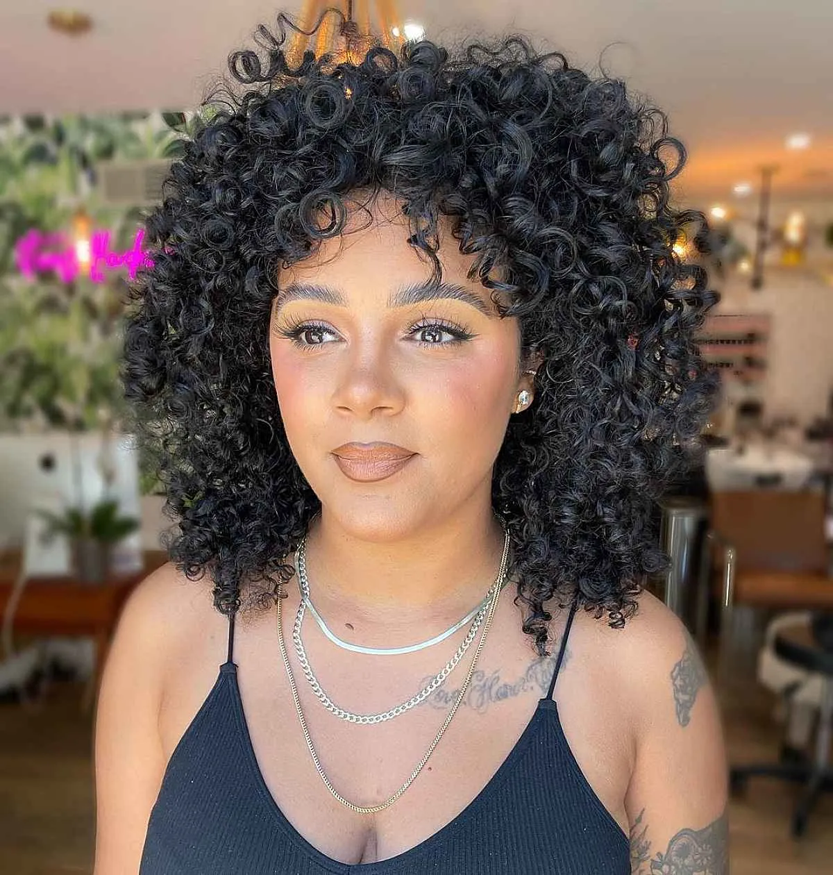 stylish short to medium curly hairstyle