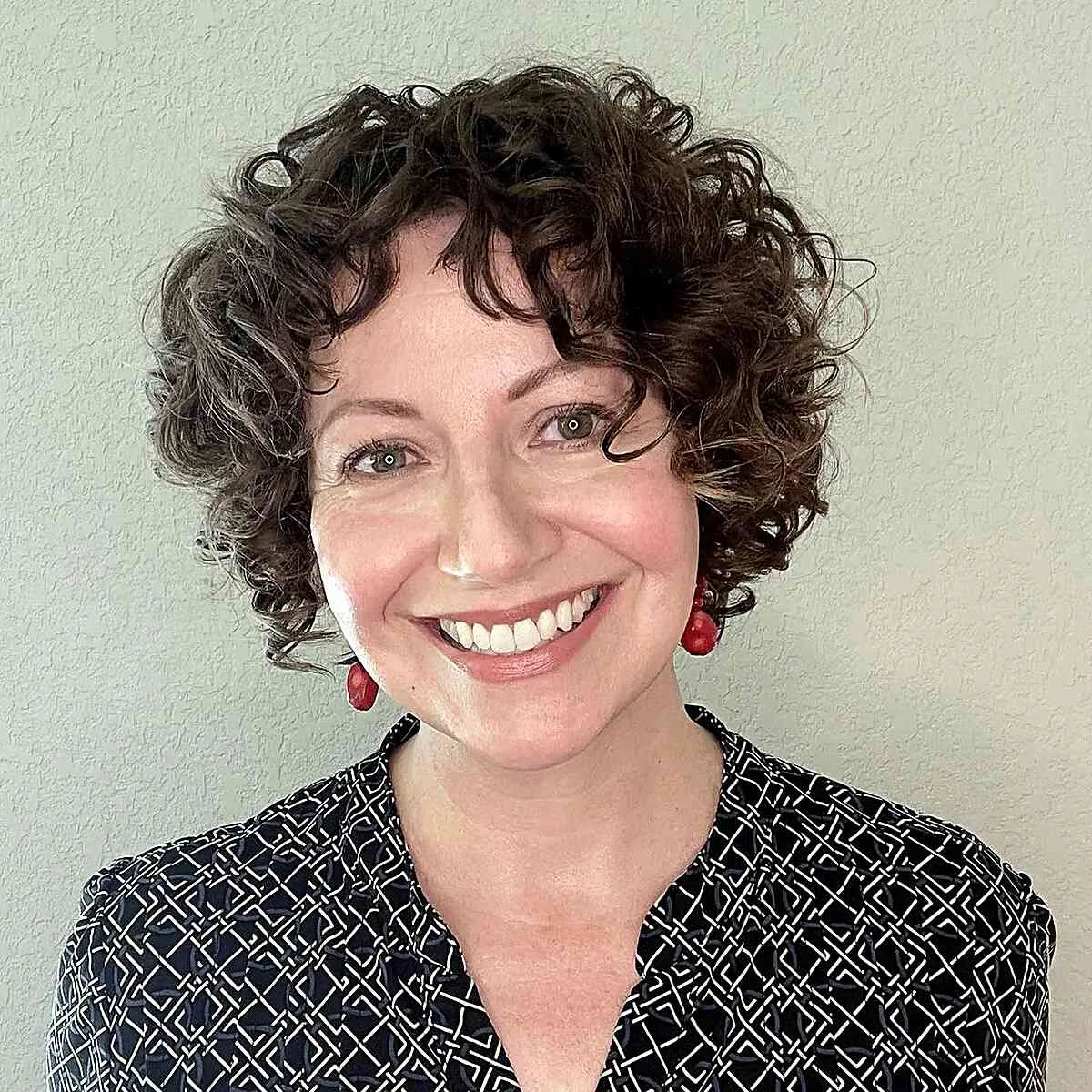 Short Radiant Curly Bob with Playful Fringe