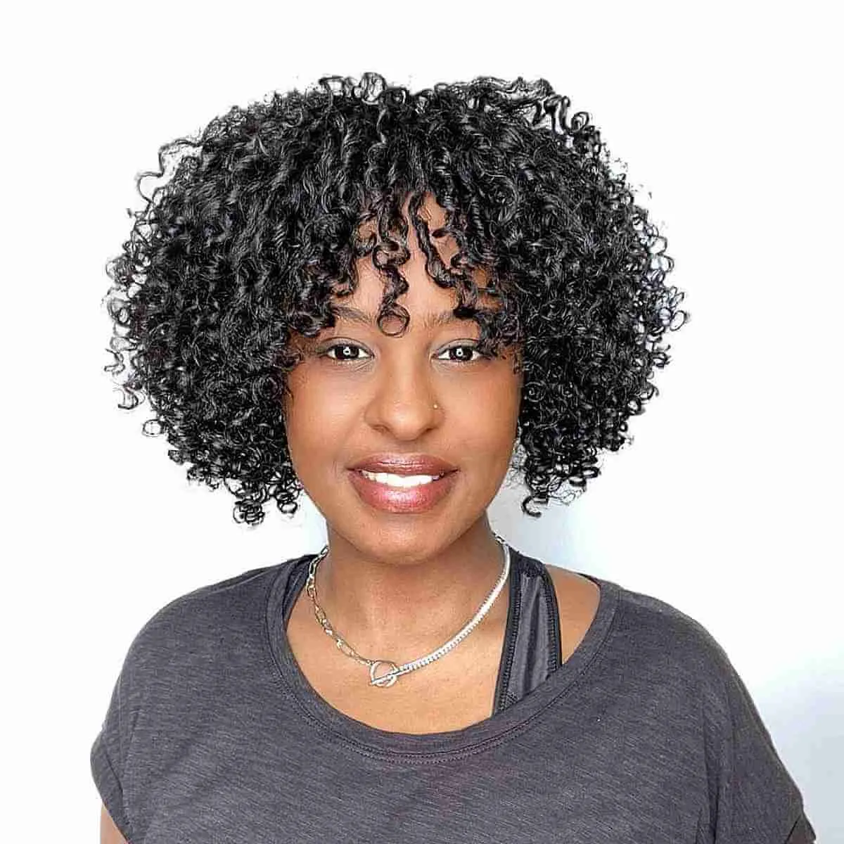 Sleek Curly Bob with Fringe