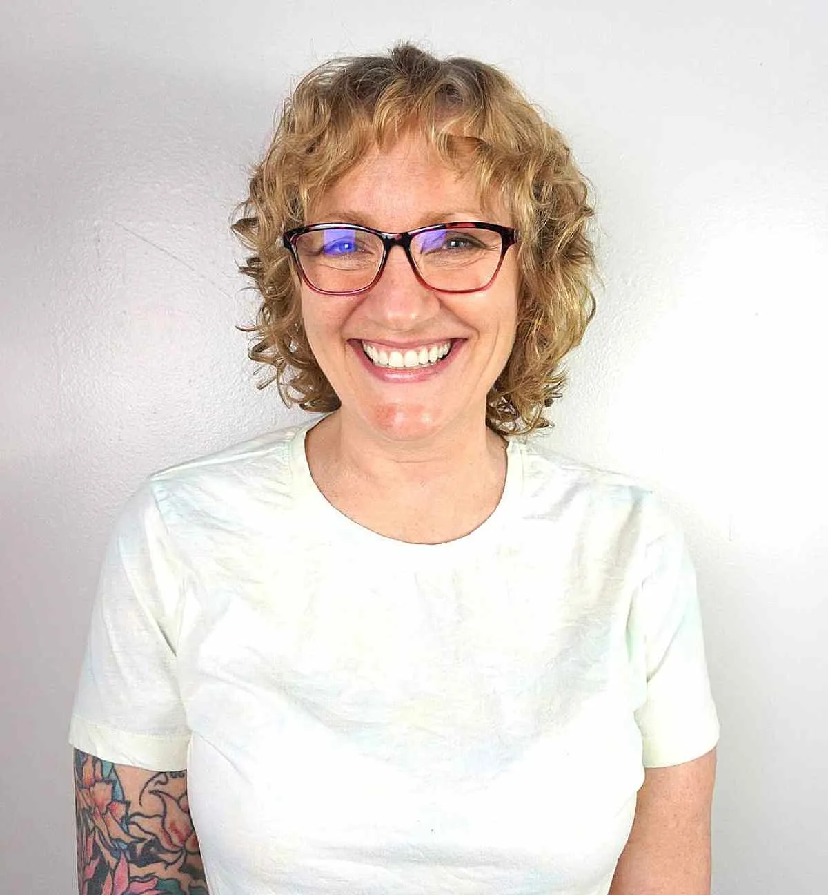 Short Textured Blonde Curls with Micro Bangs
